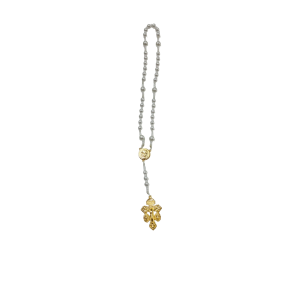 A pearl beaded necklace with a centered gold medallion and an intricate gold pendant hangs elegantly against a white background.