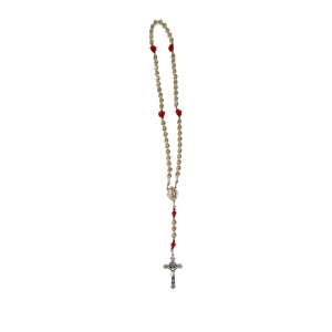 Rosary with beige beads and red accents linked to a silver crucifix. It exudes a sense of devotion and spirituality on a plain white background.