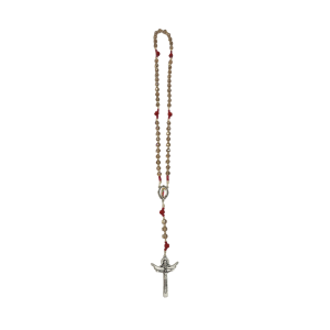 A rosary with beige beads and red accents, featuring a silver crucifix at the bottom. The piece conveys a sense of devotion and spirituality.